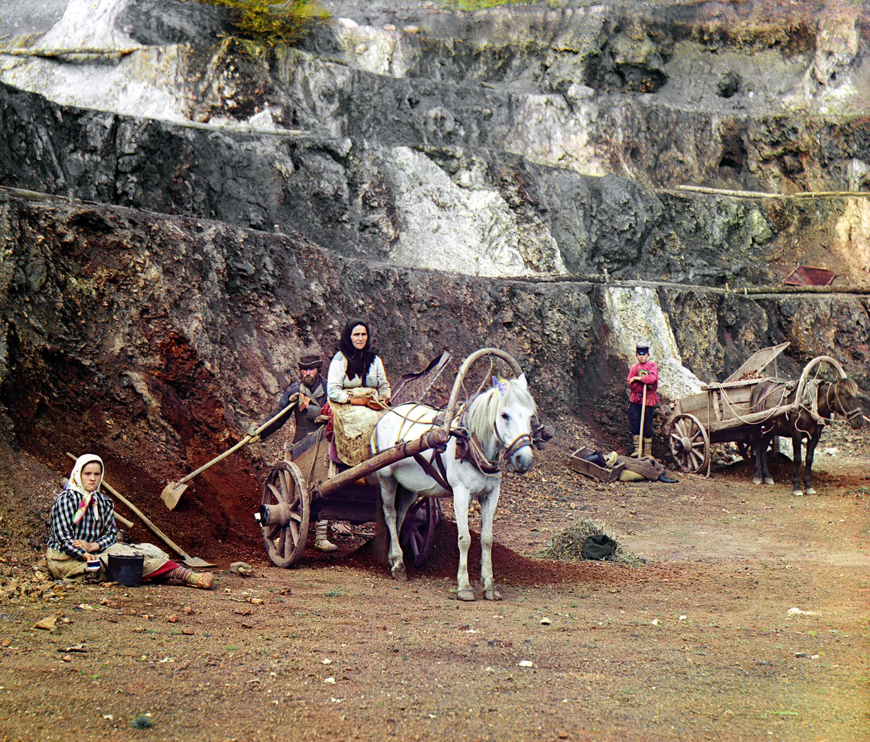 Sergey_Prokudin_Gorsky_-_Work_at_the_Bakalskii_mine_a_family_with_shovels_and_horse-drawn_carts_working_a_-_(MeisterDrucke-187116).jpg